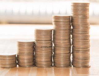 Stack of coins increasing in size