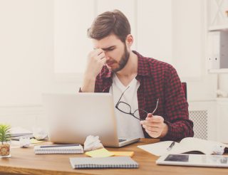 Concerned man at computer