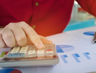 Man using calculator