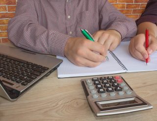 Accountants making notes